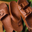 Close-up of brown Cushion Vera Cruz sandal pair, one facing up showing footbed design, other facing down, surf inspired comfort