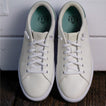Del Mar Commuter white leather sneakers with toes facing the viewer and cushioned comfort