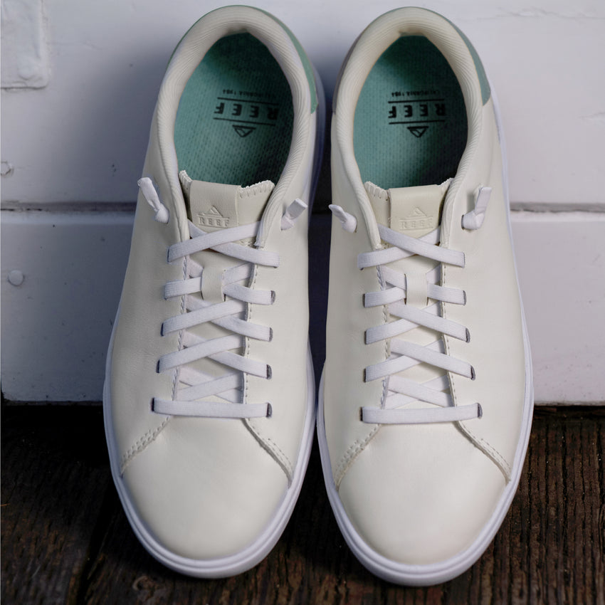 Del Mar Commuter white leather sneakers with toes facing the viewer and cushioned comfort