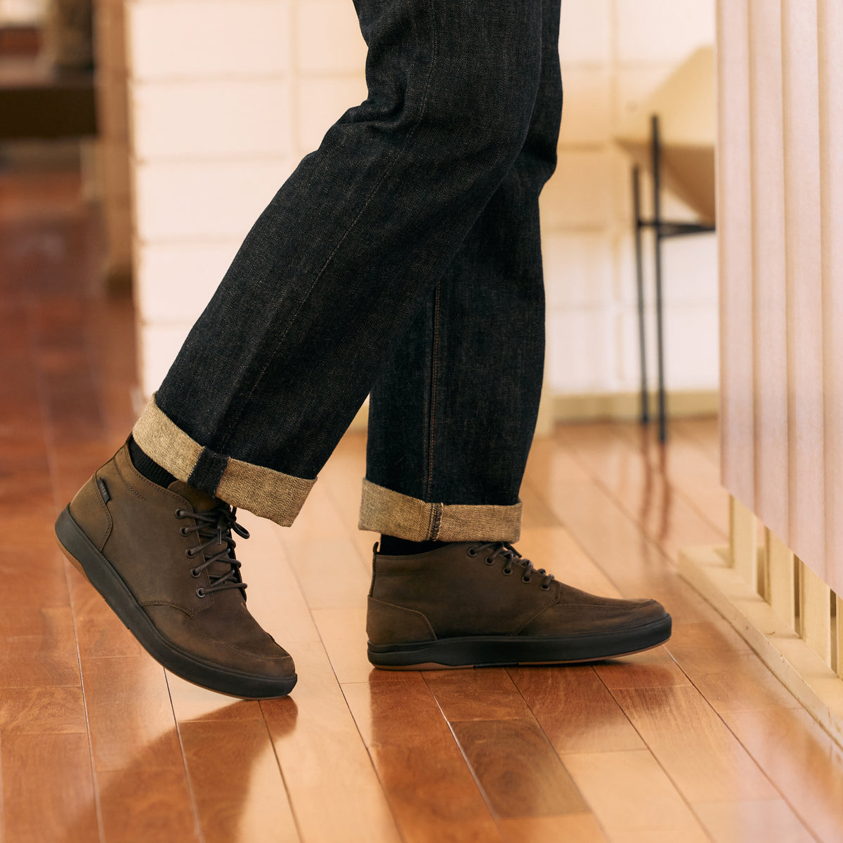 Laguna Spiniker leather mid boots shown from the side, facing right, with cushioned support and rolled jeans