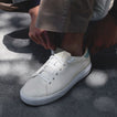 Del Mar Commuter white sneaker facing left in a close up side and top view with cushioned sole