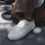 Del Mar Commuter white sneaker facing left in a close up side and top view with cushioned sole