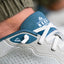 Close-up of the Shoreline Del Mar left sneaker facing right, showing the tongue and laces with surf-inspired comfort design.