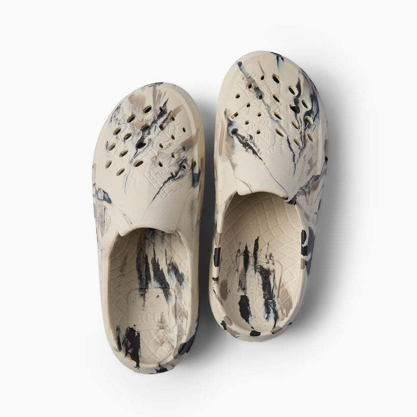Glider water friendly clogs facing upward with perforated uppers and cushioned molded footbeds
