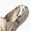 Glider close up facing upper right showing the molded toe and cushioned footbed in a water friendly design