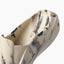Glider close up facing upper right showing the molded toe and cushioned footbed in a water friendly design