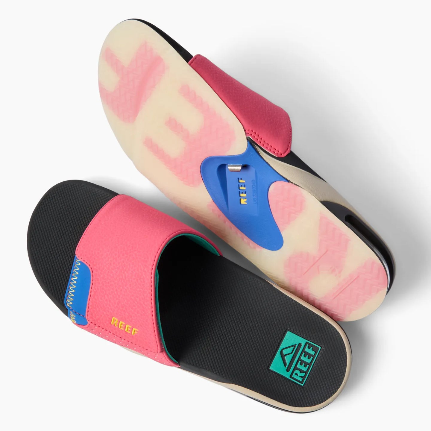 Pair of Fanning Slide sandals shown with left sandal top view and right sandal sole view facing right, featuring bottle opener.