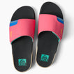 Pair of Fanning Slide sandals viewed from above facing up, featuring pink straps and black footbeds with arch support.