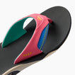 Close-up of the right-facing Fanning flip flop showing pink strap with anatomical arch support and black footbed.