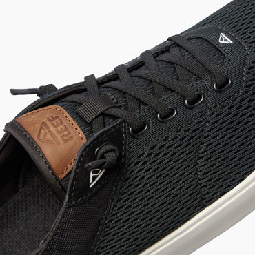 Laguna black sneaker facing left, close-up of breathable upper and lace details