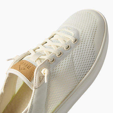 Laguna sneaker facing upper right, close up of breathable mesh upper, laces, and cushioned footbed for comfort