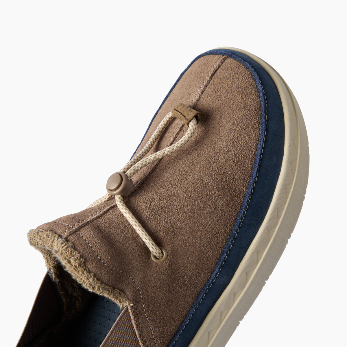 Rambler brown suede slipper facing lower left, close-up of the terrycloth-lined upper and cushioned side outsole