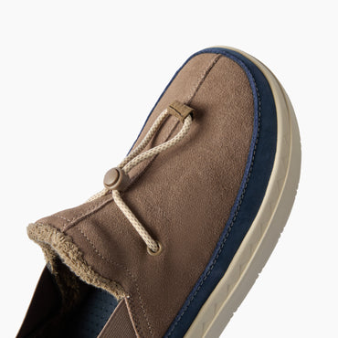 Rambler brown suede slipper facing lower left, close-up of the terrycloth-lined upper and cushioned side outsole