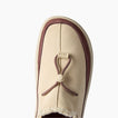 Rambler slipper with toe facing upward, close-up of suede upper and adjustable toggle for cushioned comfort