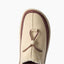Rambler slipper with toe facing upward, close-up of suede upper and adjustable toggle for cushioned comfort