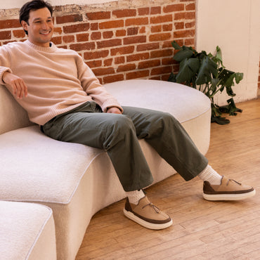 Rambler suede shoes worn with toes facing right featuring thick cushioned soles and everyday comfort