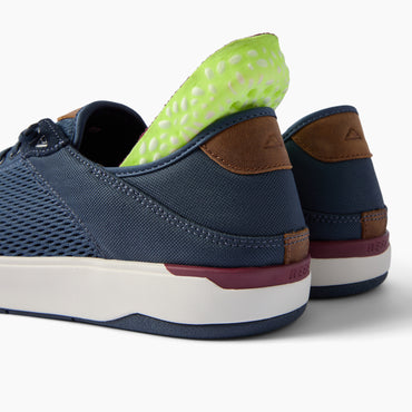 Laguna REEF sneakers facing away from the viewer with a close up of the heel and fold down heel design