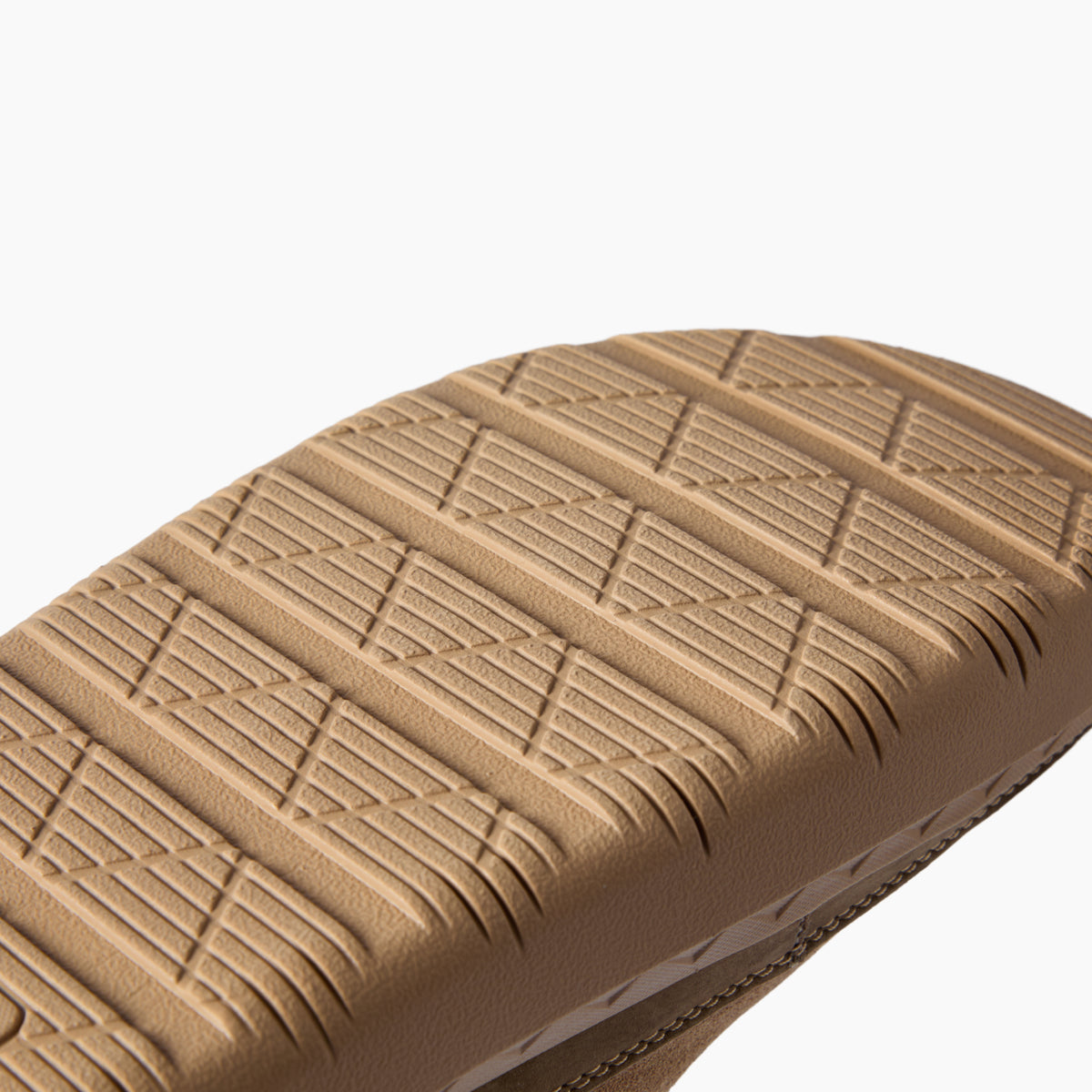 Rambler Mule outsole close-up facing right, showing textured tread for durable traction and everyday comfort