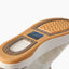 Laguna shoe with toe facing upper right, close up of textured outsole tread and cushioned sole