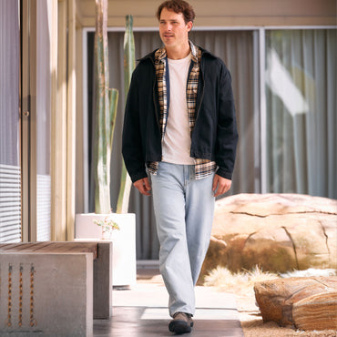 Del Mar Desert leather shoes facing forward as a man walks toward the camera, featuring a comfortable cushioned design