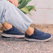 Shoreline Del Mar sneakers on feet facing right, showing mesh uppers, elastic laces, and cushioned soles