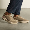 Shoreline Del Mar sneakers on feet, toes facing right, showing cushioned soles and elastic laces