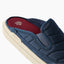 Close up of a navy slide facing left with a padded upper, red footbed, and cushioned cream sole