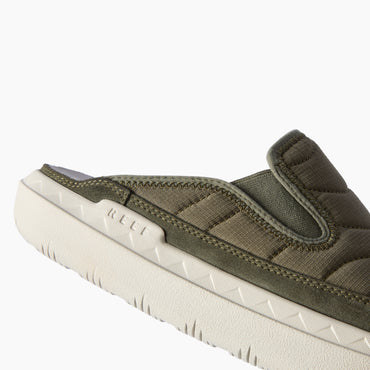 Close-up side view of olive green footwear facing left, with a padded upper and textured cream sole
