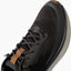 Zuma black sneaker close up facing upper right showing the knit toe and lace up upper