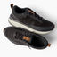 Zuma black sneakers one facing right and one facing left with breathable knit uppers and cushioned comfort