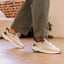 Zuma sneakers facing right with breathable knit uppers and cushioned soles for everyday comfort