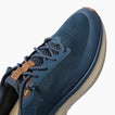 Reef Zuma blue sneaker close-up with toe facing upper right, showing knit upper and laces