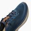 Reef Zuma blue sneaker close-up with toe facing upper right, showing knit upper and laces