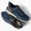 Reef Zuma navy knit sneakers facing upper right and lower left with cushioned soles and flexible heels