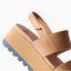 Water Vista Higher sandal close-up of heel and navy sole facing left with adjustable tan straps and platform for beach comfort