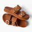 Top and side view of Vista Daphne cognac suede slide sandal with adjustable buckles, highlighting arch support and comfort features.