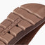 Vista Luxe Mariana brown suede clog outsole facing the camera in close up with textured tread for comfortable everyday wear