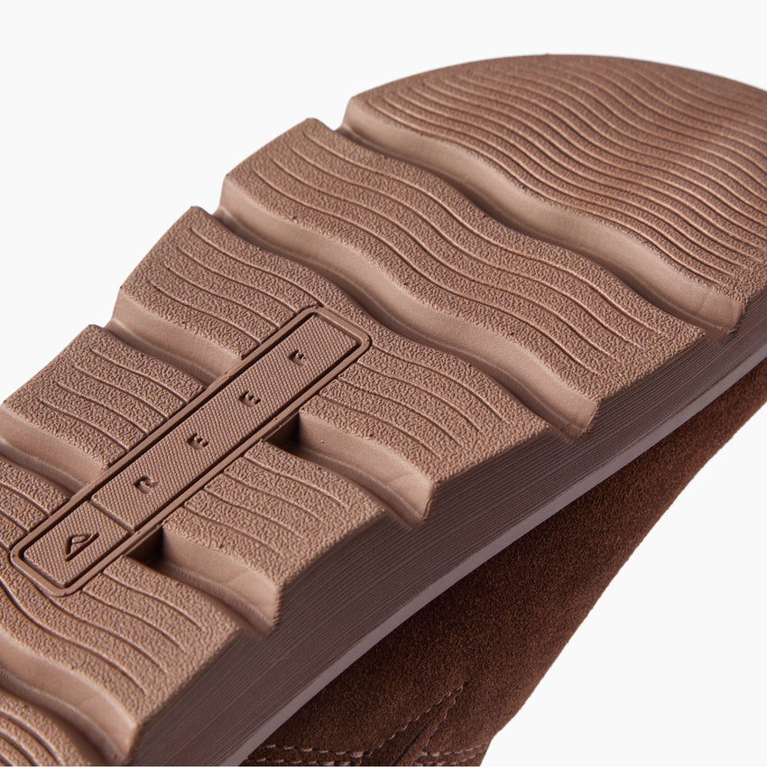 Vista Luxe Mariana brown suede clog outsole facing the camera in close up with textured tread for comfortable everyday wear
