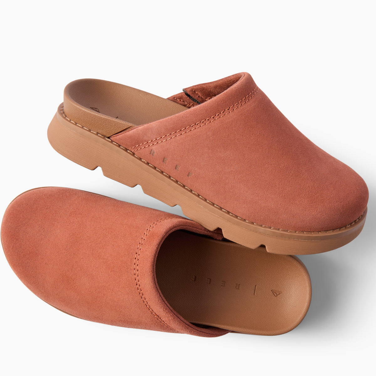Vista Luxe Mariana suede clogs, one facing right and one facing left, with cushioned footbeds and supportive soles