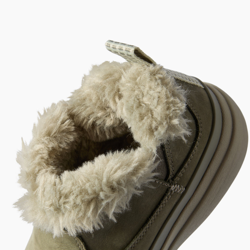 Weekend Olivia close up facing left showing plush faux fur lining and lightweight cushioned sole