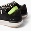 Rear view close-up of black Reef Del Mar shoes with visible cushioning insert, showcasing comfort and durable design.