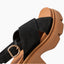 Vista Luxe Ava black suede sandal facing upper right, close-up of crossover straps, buckle, and cushioned footbed