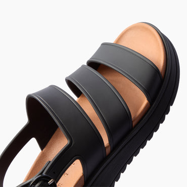 Vista Marbella black three strap sandal with toe facing upper right close up of cushioned footbed and arch support