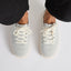 Neptune 2 light gray sneakers viewed from above, facing forward with cushioned soles and lace-up fronts
