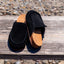 Pair of black Vista Myra clogs facing forward, women's leather slip-ons with cork footbeds and enhanced arch support for comfort.