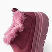 Weekend Olivia pink boot facing left in a close up side view with plush faux fur lining and a cushioned sole