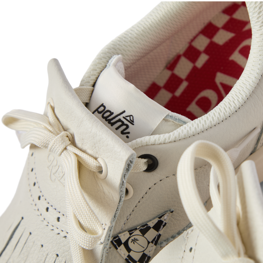 Close-up of the front and top of the Onshore Pebble X Palm men's shoe facing forward, showing comfort details and surf-inspired design.