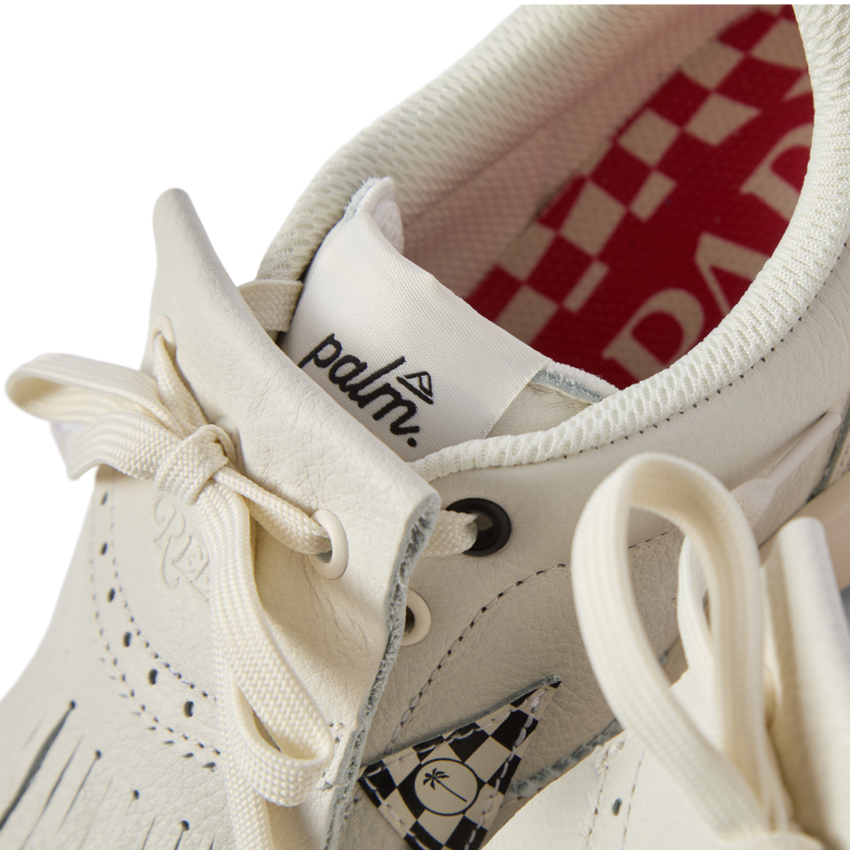 Close-up of the front and top of the Onshore Pebble X Palm men's shoe facing forward, showing comfort details and surf-inspired design.