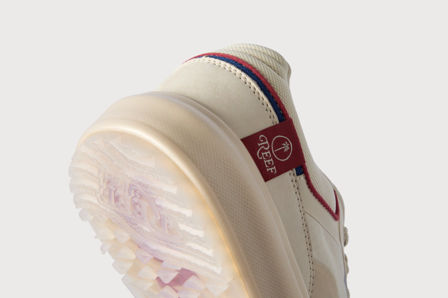 Close up of a cream REEF sneaker heel and outsole facing away