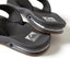 Close-up of the front of the black Fanning men's sandals facing right, featuring soft-rebound cushioning and arch support.